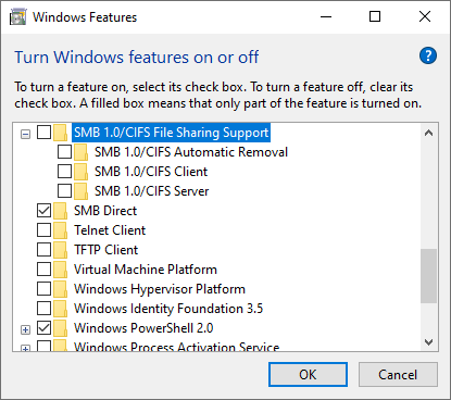 Screenshot of the Windows Features dialog with the unchecked option 'SMB 1.0 Support'